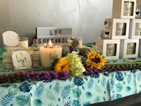 a table with candles and flowers on it